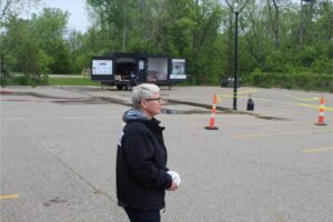 Person in parking lot with trailer