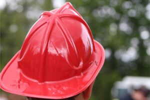 Red firefighter helmet outdoors