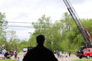 Person observing outdoor community event
